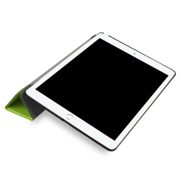 a white tablet with a green cover